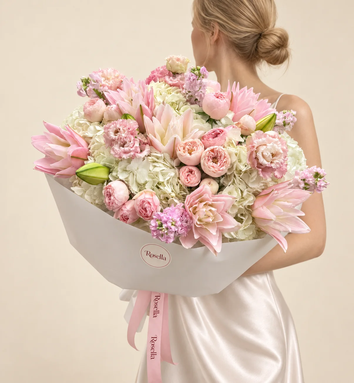 7 hydrangeas, 16 garden roses, 12 lily blooms, 4 stocks & 11 lisianthus blooms in a hand-tied bouquet