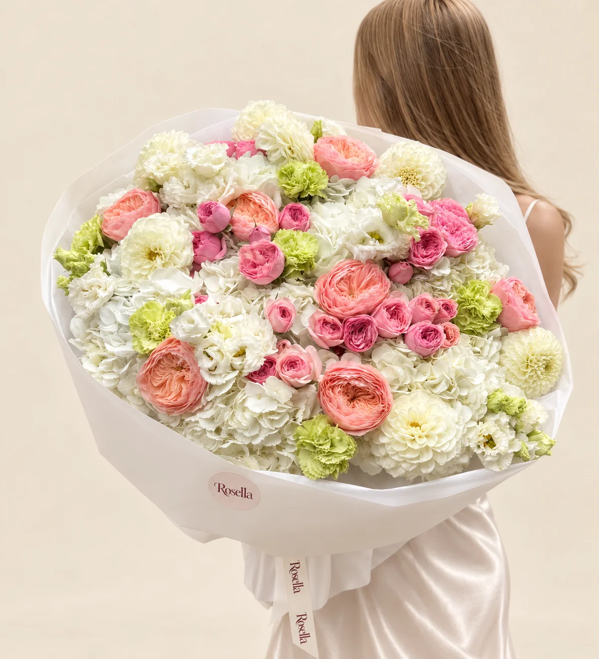 9 hydrangeas, 8 garden roses, 28 spray roses, 6 dahlias, 10 green carnations, 20 lisianthus blooms & 4 white carnations in a hand-tied bouquet