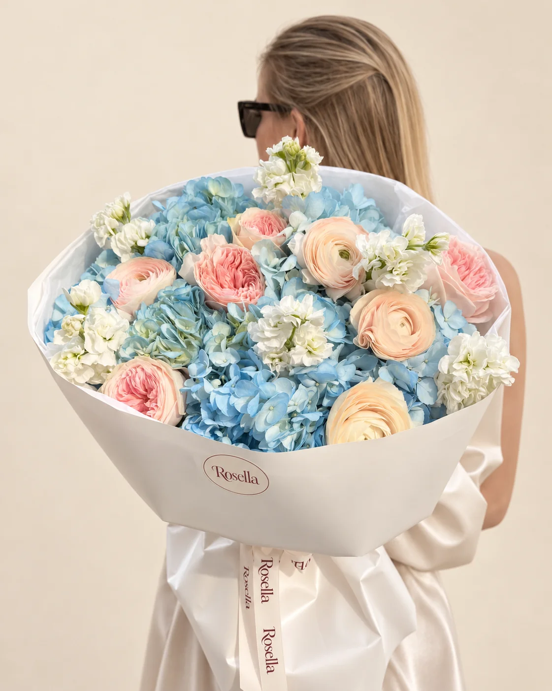 4 hydrangeas, 4 garden roses, 4 stocks & 4 ranunculus in a hand-tied bouquet