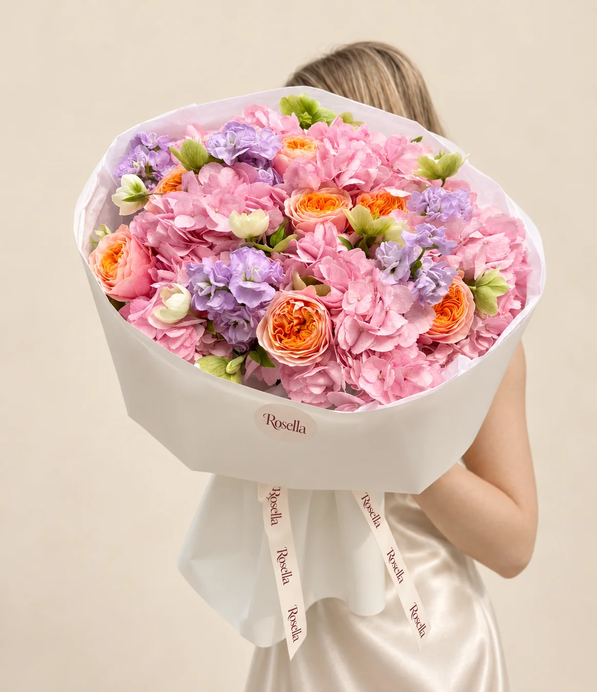 6 hydrangeas, 7 garden roses, 3 stocks & 12 helleborus in a hand-tied bouquet