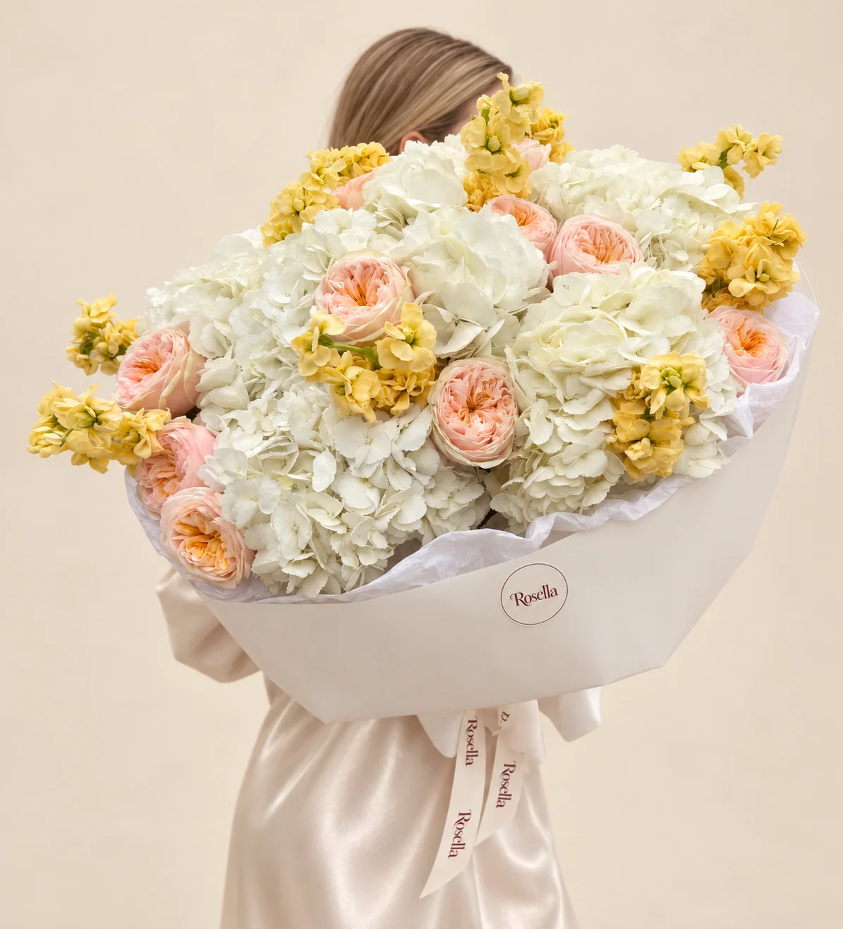 8 hydrangeas, 12 garden roses & 5 stocks in a hand-tied bouquet