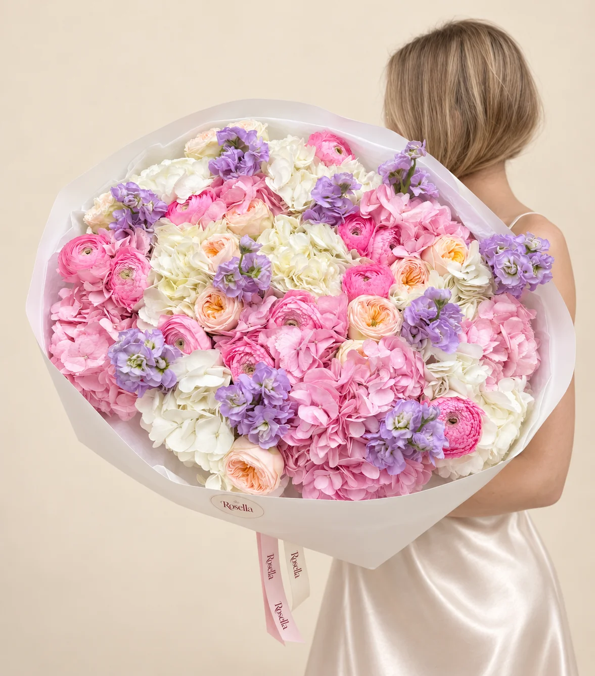 9 pink hydrangeas, 8 white hydrangeas, 13 garden roses, 13 ranunculus blooms & 5 stocks in a hand-tied bouquet