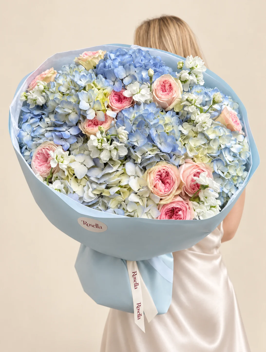 8 hydrangeas, 12 garden roses & 3 stocks in a hand-tied bouquet