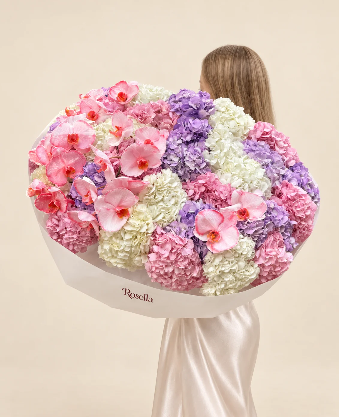 12 white hydrangeas, 12 lavender hydrangeas, 11 pink hydrangeas & 20 orchid blooms in a hand-tied bouquet