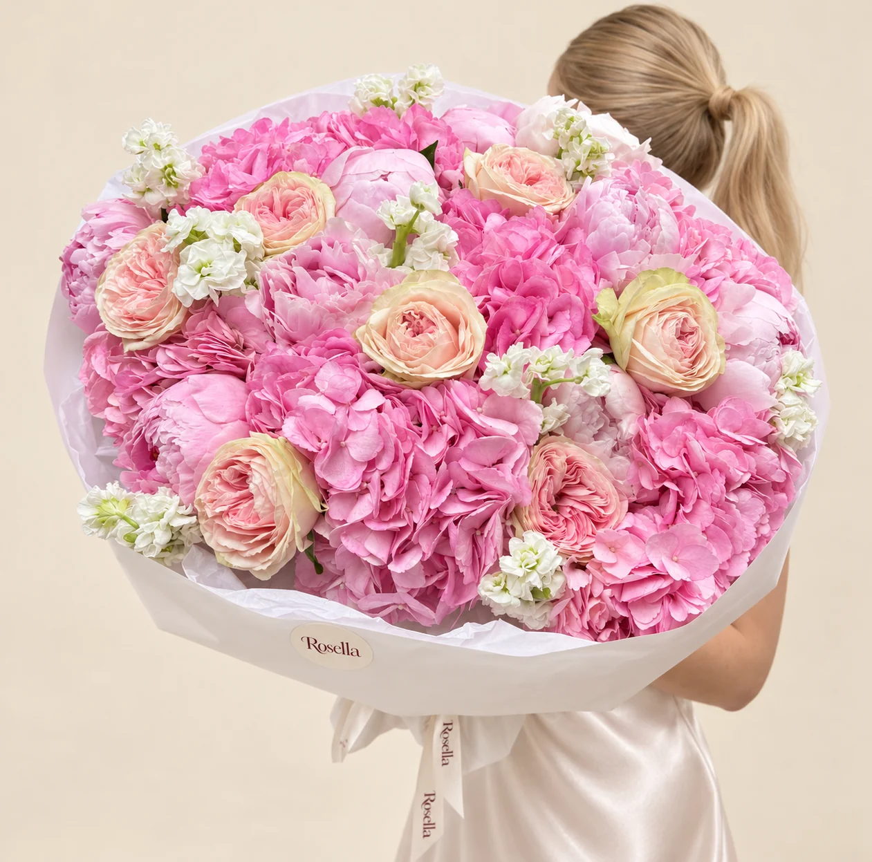 10 hydrangeas, 10 pink peonies, 9 garden roses, 4 stocks & 1 white peony in a hand-tied bouquet