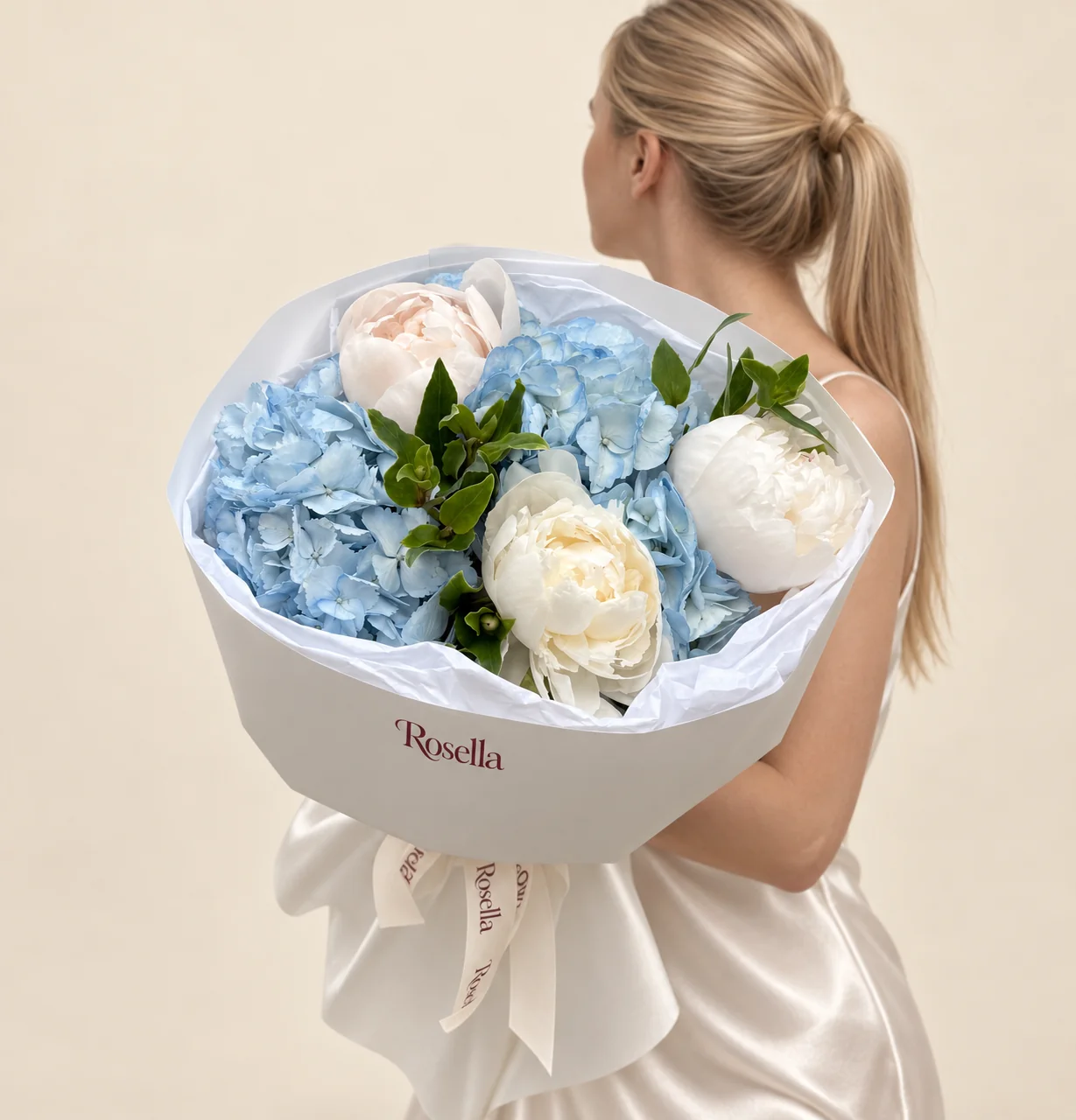 3 hydrangeas, 2 ivory peonies & 1 blush peony in a hand-tied bouquet