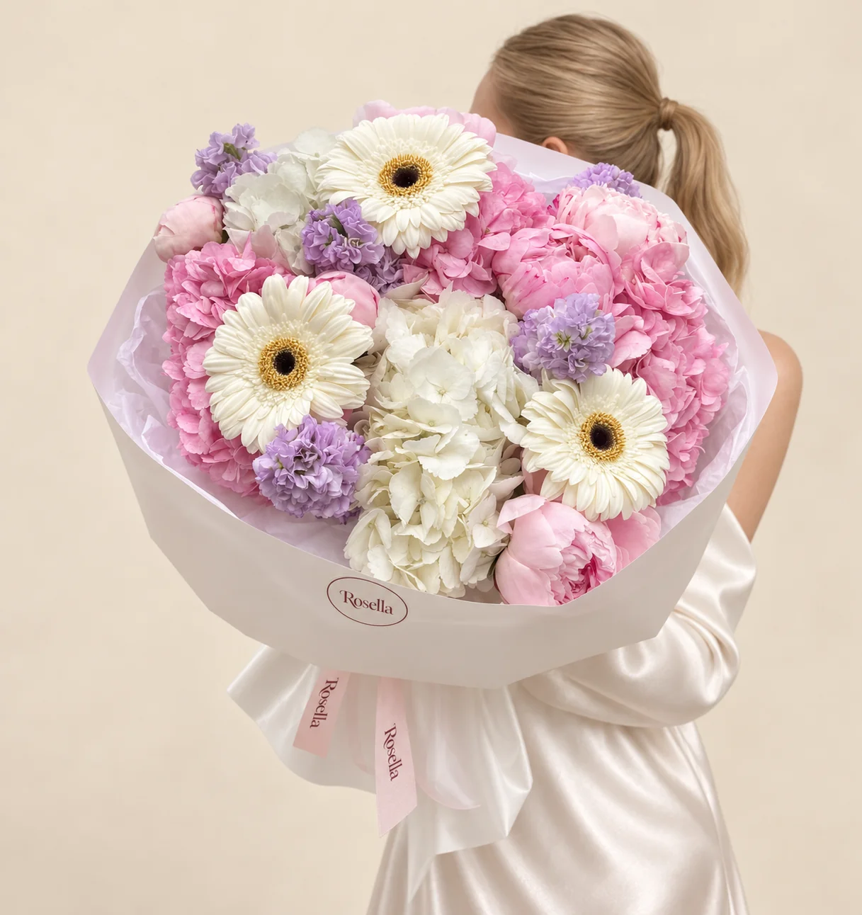 4 pink hydrangeas, 7 peonies, 3 white hydrangeas, 5 stocks & 3 gerberas in a hand-tied bouquet