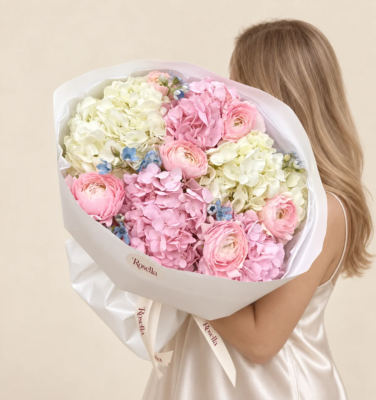 3 pink hydrangeas, 2 white hydrangeas, 7 ranunculus & 18 tweedia blooms in a hand-tied bouquet