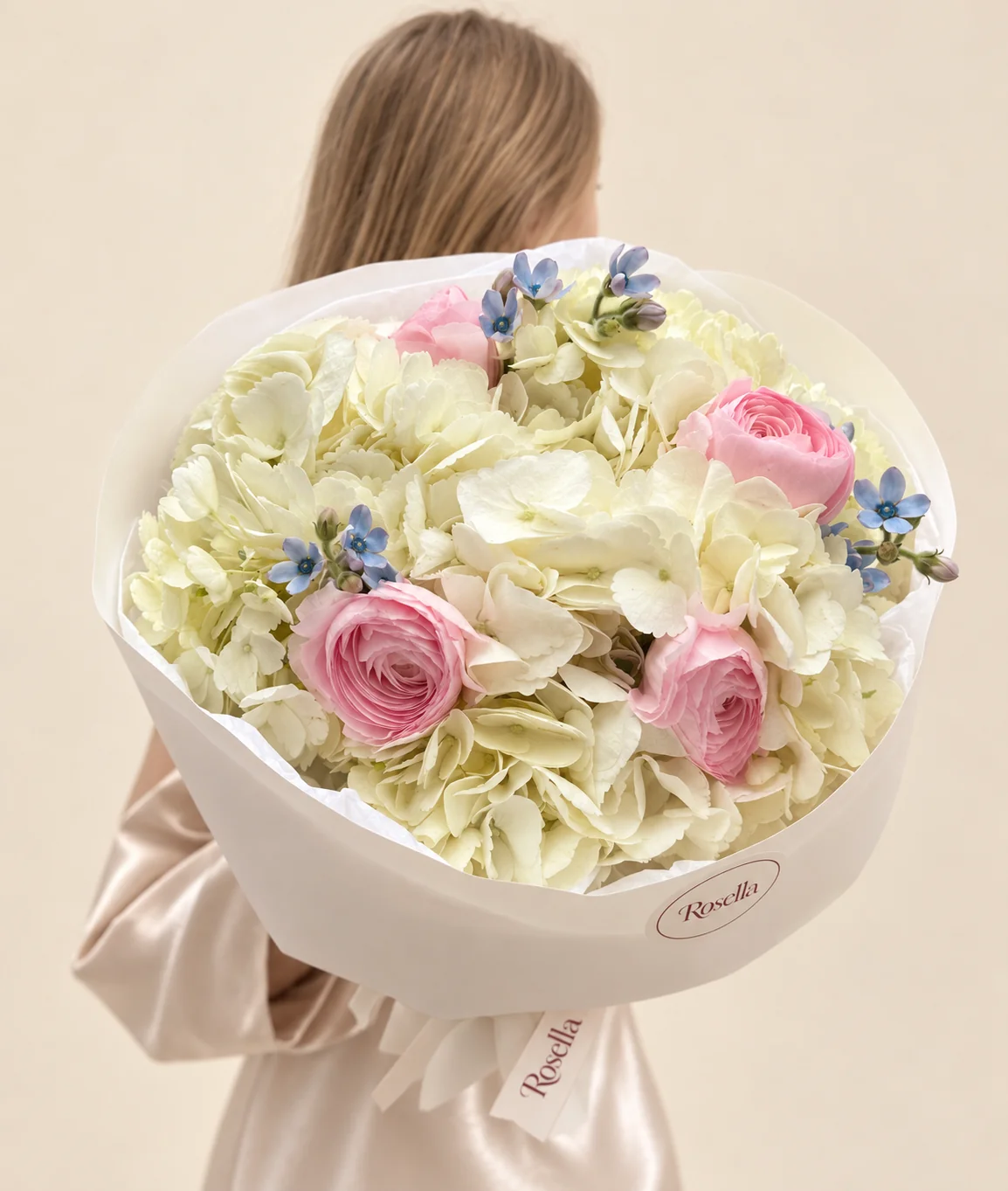 4 hydrangeas, 4 ranunculus & 11 tweedia blooms in a hand-tied bouquet