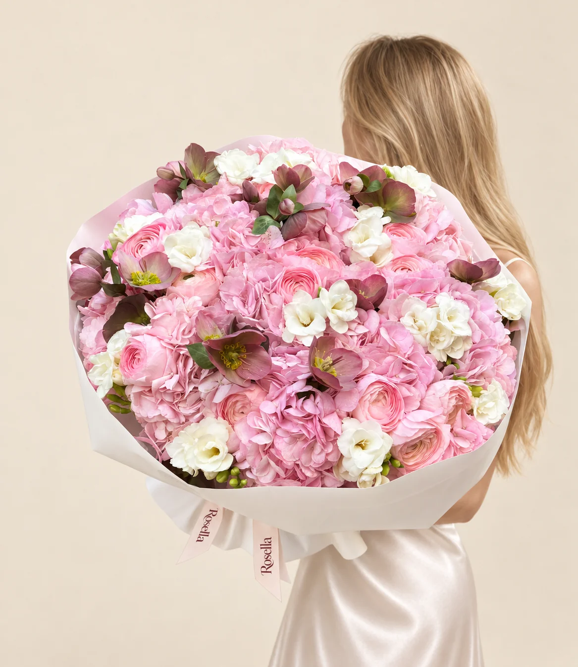 11 hydrangeas, 15 ranunculus, 19 helleborus & 10 freesias in a hand-tied bouquet