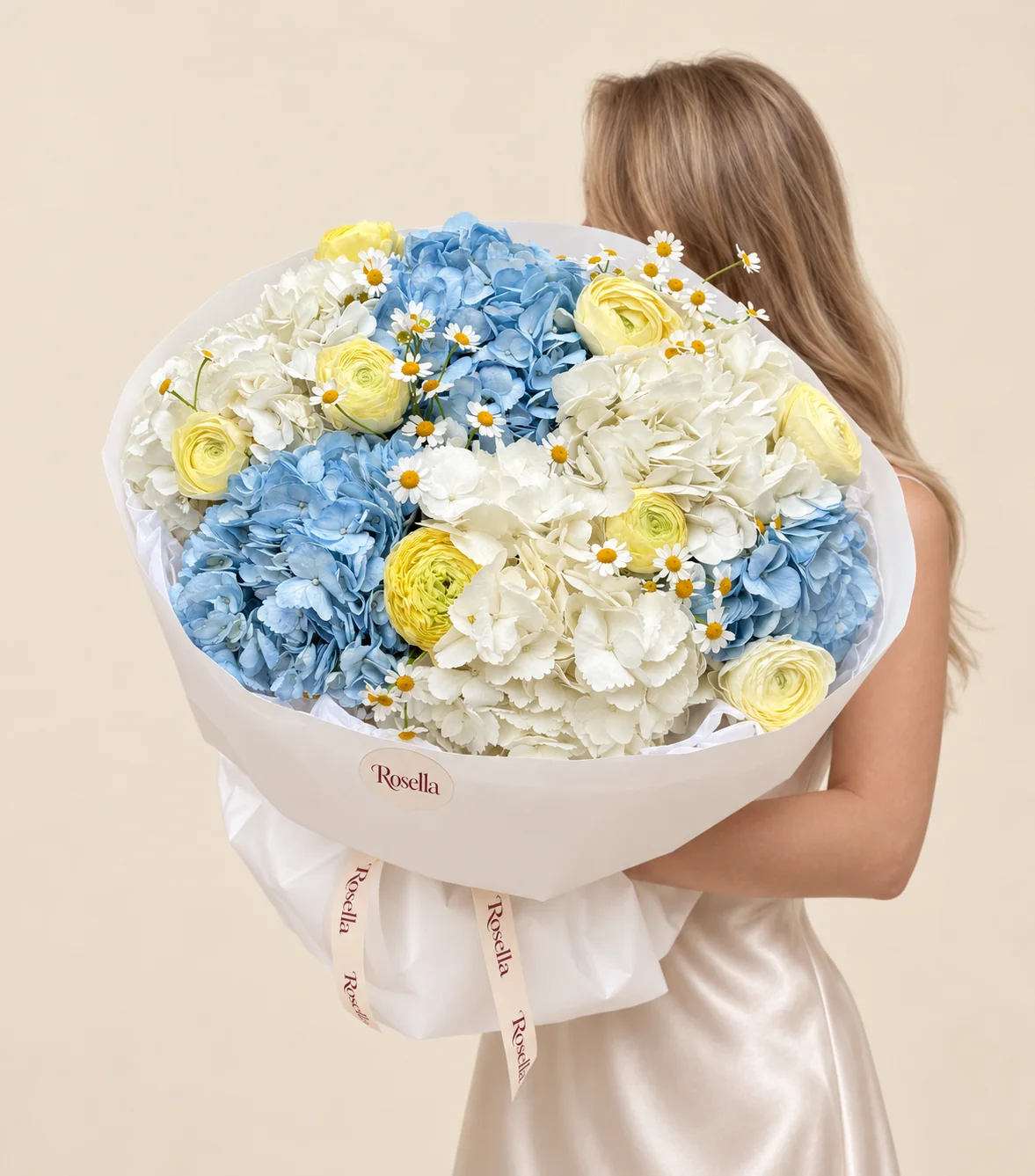 4 white hydrangeas, 3 blue hydrangeas, 9 ranunculus & 45 chamomile blooms in a hand-tied bouquet