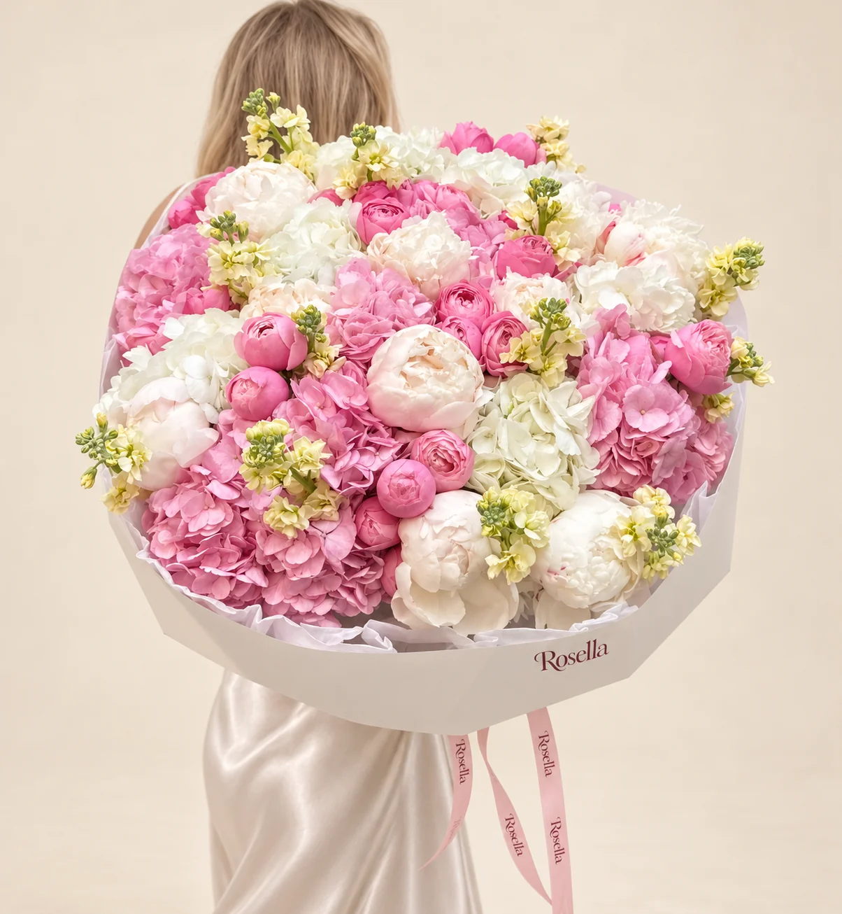 8 white hydrangeas, 7 pink hydrangeas, 24 roses, 11 peonies & 9 stocks in a hand-tied bouquet