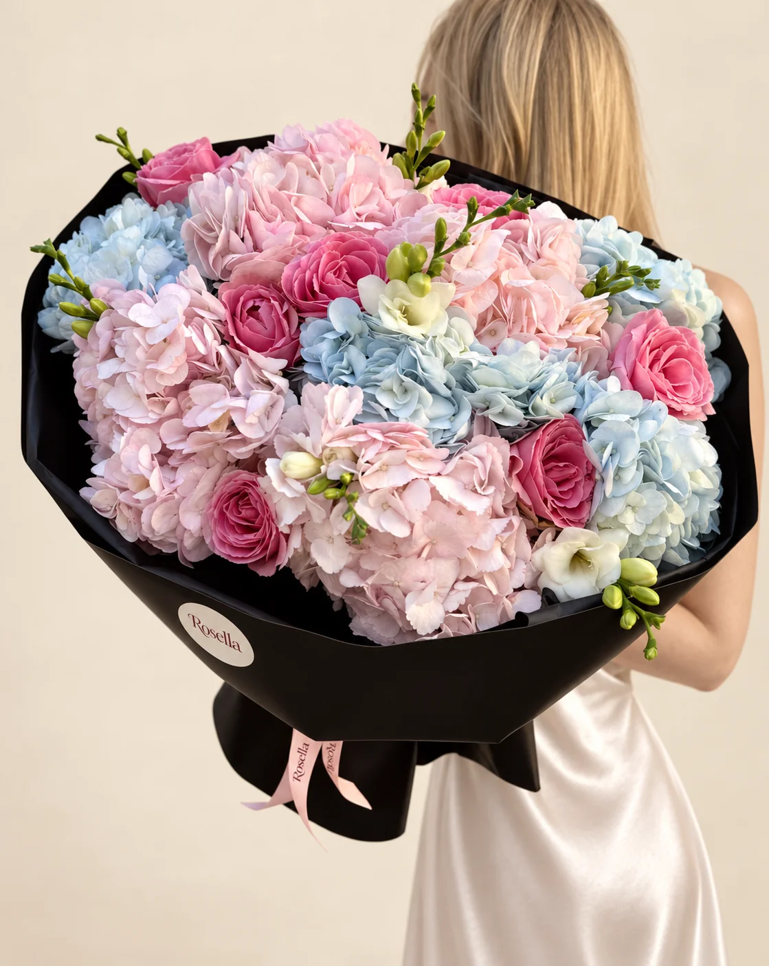 5 pink hydrangeas, 5 blue hydrangeas, 9 roses & 2 freesias in a hand-tied bouquet