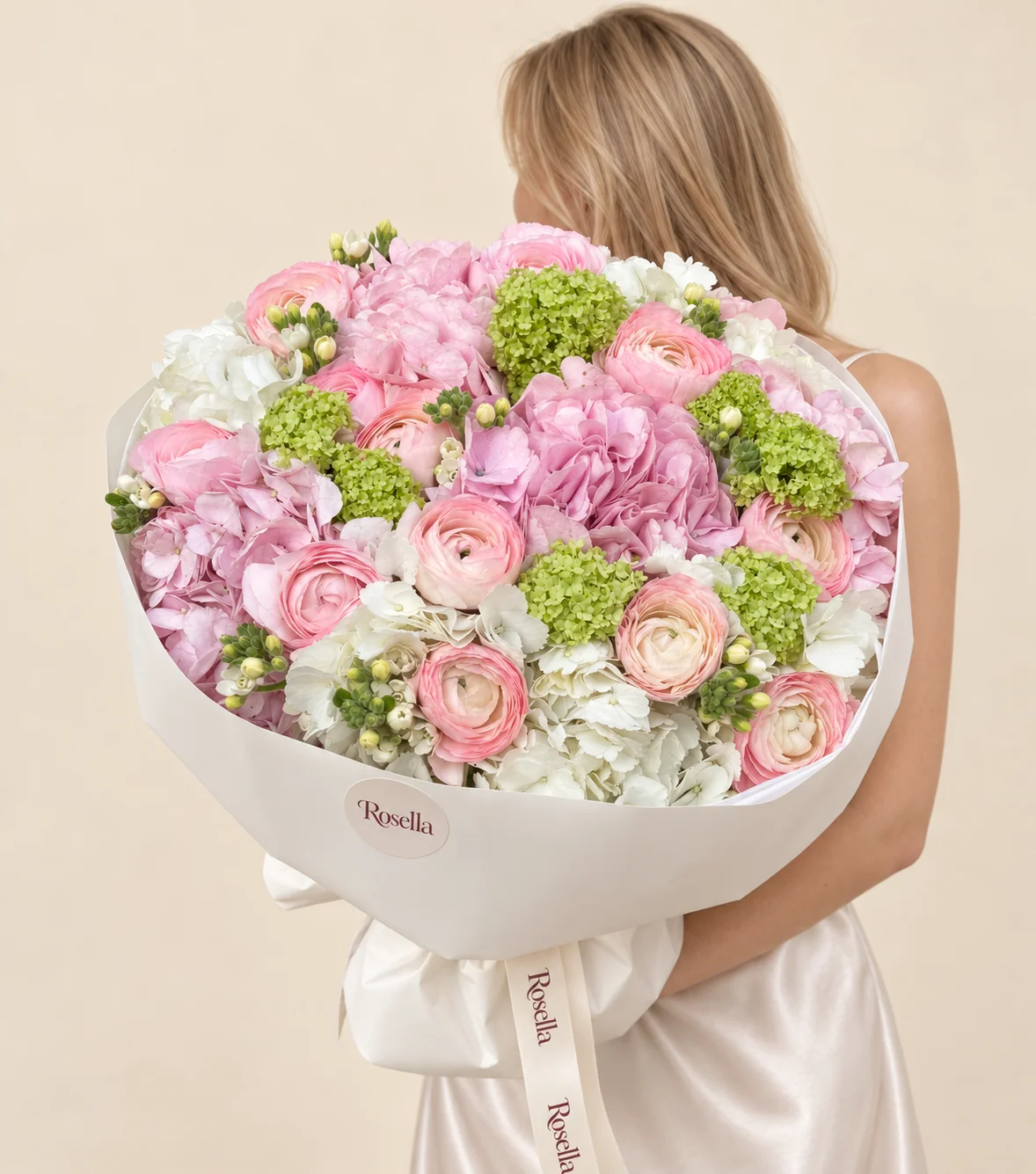 6 white hydrangeas, 5 pink hydrangeas, 8 green snowball viburnum, 35 white bouvardia & 14 ranunculus in a hand-tied bouquet