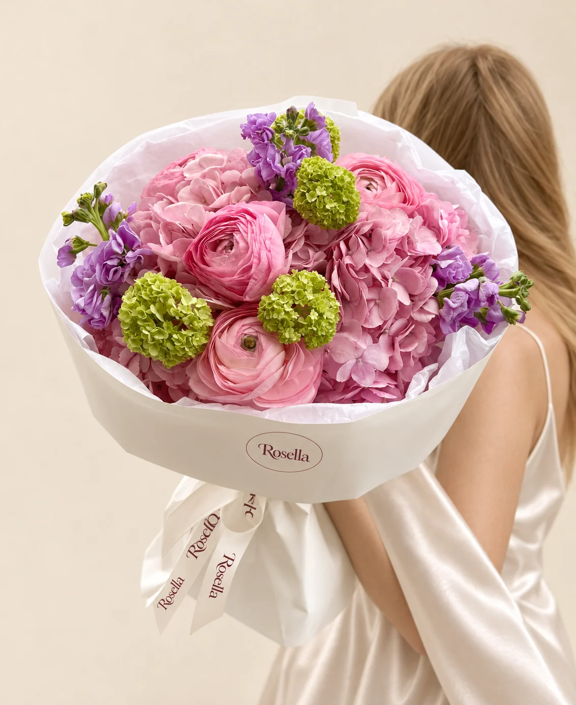 2 hydrangeas, 4 green snowball viburnum, 2 stocks & 4 ranunculus in a hand-tied bouquet