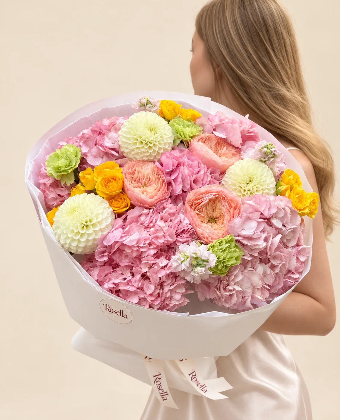 6 hydrangeas, 12 spray roses, 3 dahlias, 3 garden roses, 2 stocks & 3 carnations in a hand-tied bouquet
