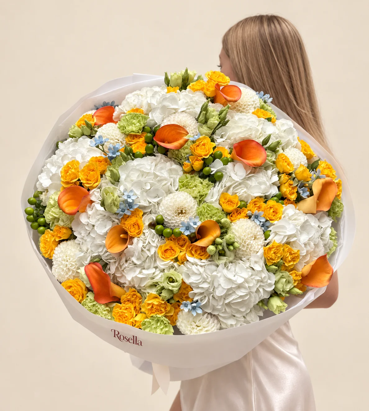 14 hydrangeas, 58 spray roses, 10 dahlias, 12 carnations, 11 callas, 17 lisianthus blooms & 21 tweedia blooms in a hand-tied bouquet
