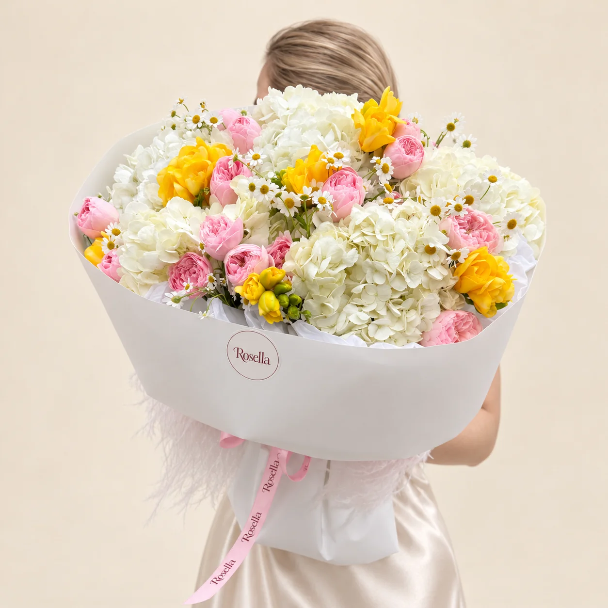 5 hydrangeas, 18 spray roses, 12 yellow double daffodil, 43 chamomile blooms & 1 freesia in a hand-tied bouquet
