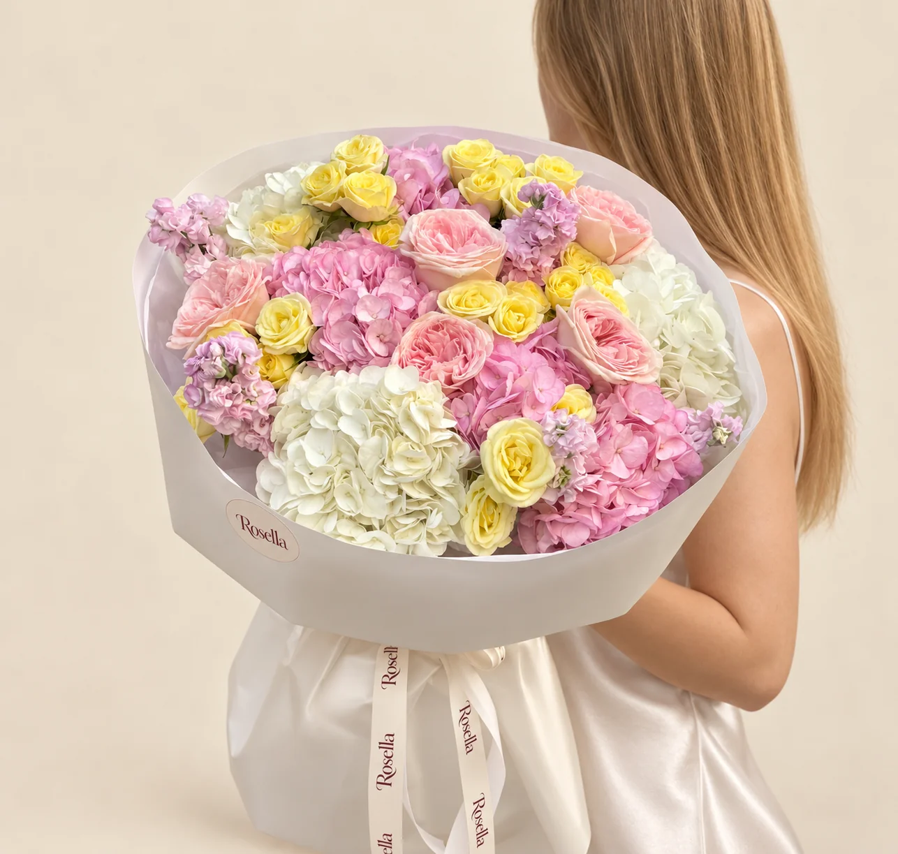 4 pink hydrangeas, 29 spray roses, 3 white hydrangeas, 6 garden roses & 5 stocks in a hand-tied bouquet