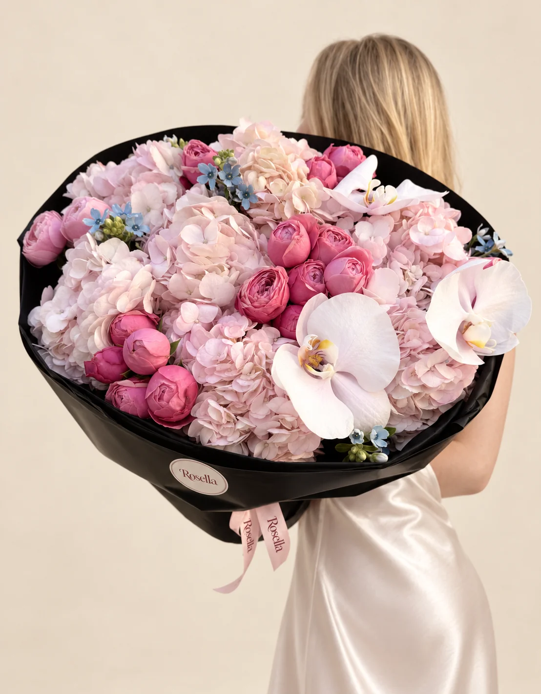 7 hydrangeas, 20 spray roses, 3 orchid blooms & 12 tweedia blooms in a hand-tied bouquet