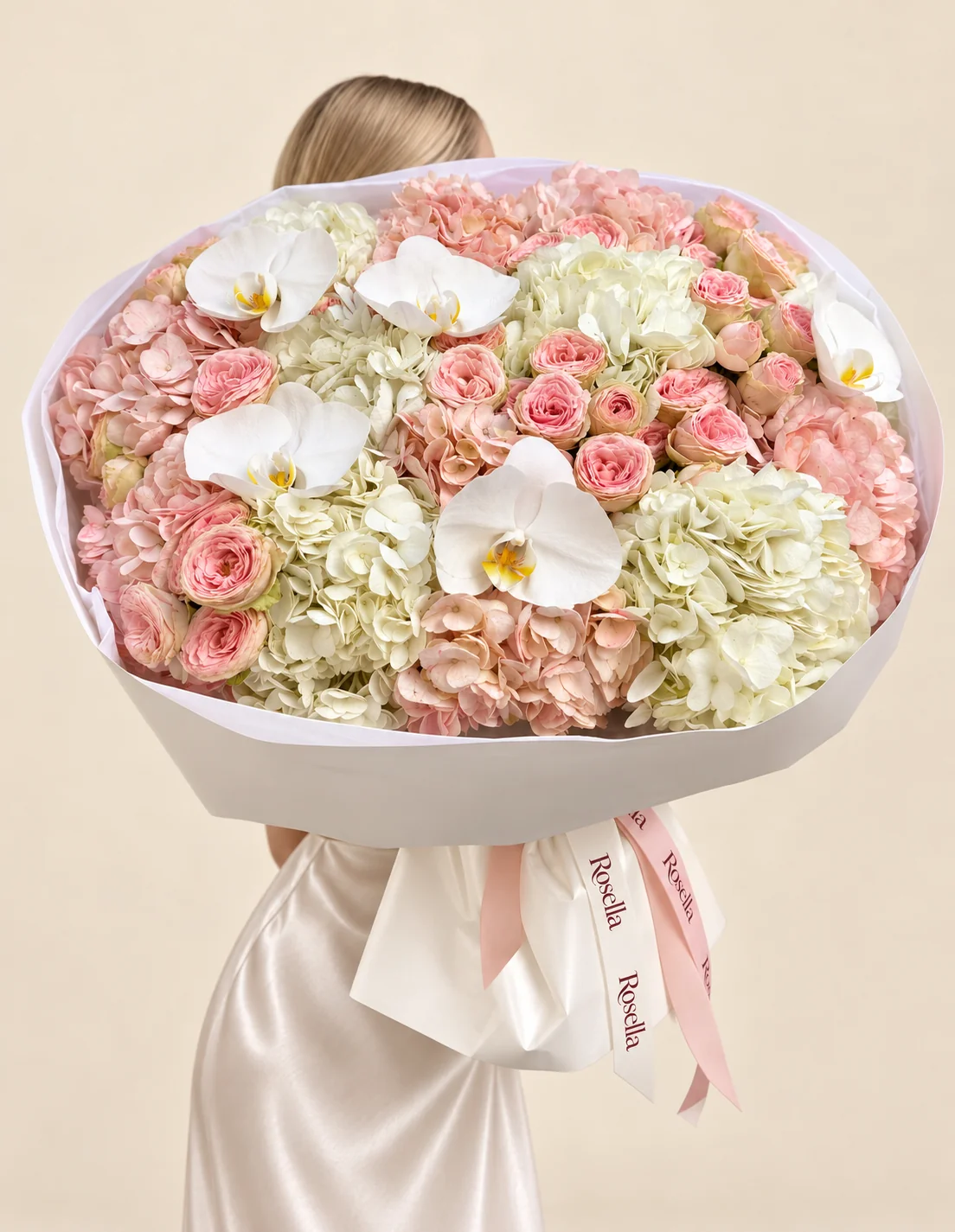 8 blush hydrangeas, 6 white hydrangeas, 28 spray roses & 5 orchid blooms in a hand-tied bouquet