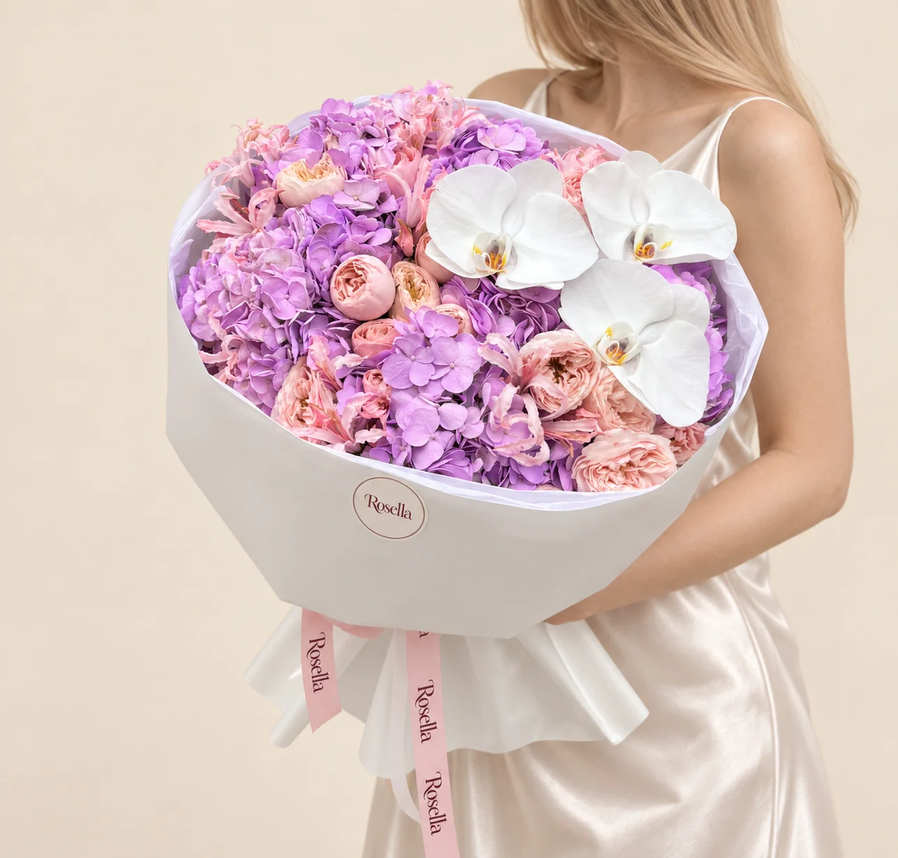 6 hydrangeas, 17 spray roses, 15 pale-pink nerine & 3 orchid blooms in a hand-tied bouquet
