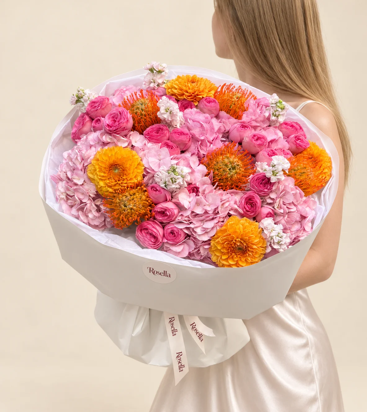 7 hydrangeas, 28 spray roses, 5 orange pincushion protea (leucospermum), 4 dahlias & 3 stocks in a hand-tied bouquet