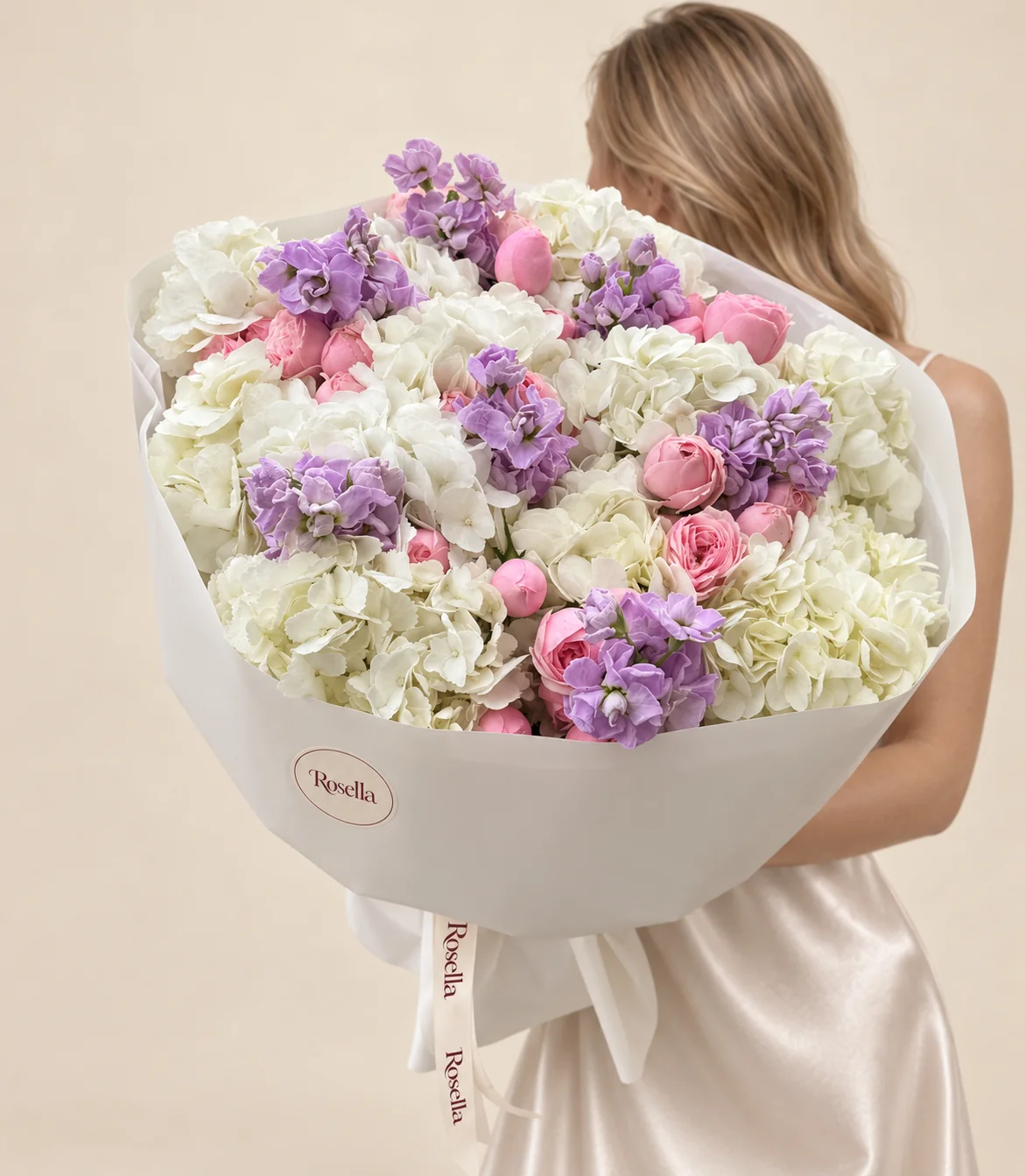 12 hydrangeas, 26 spray roses & 4 stocks in a hand-tied bouquet