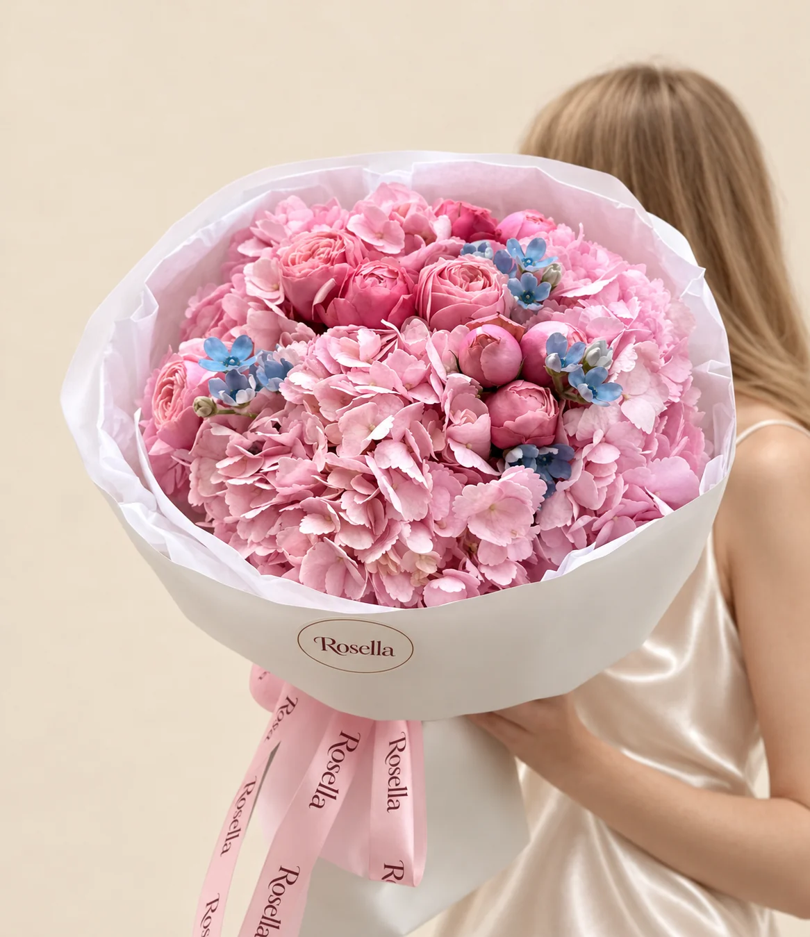 3 hydrangeas, 11 spray roses & 15 tweedia blooms in a hand-tied bouquet