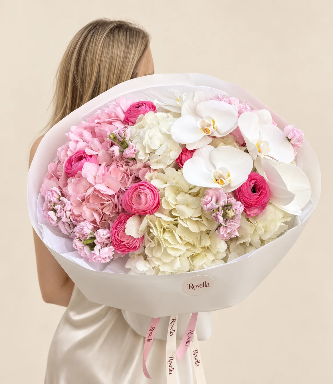 3 pink hydrangeas, 3 white hydrangeas, 3 stocks, 6 ranunculus & 5 orchid blooms in a hand-tied bouquet