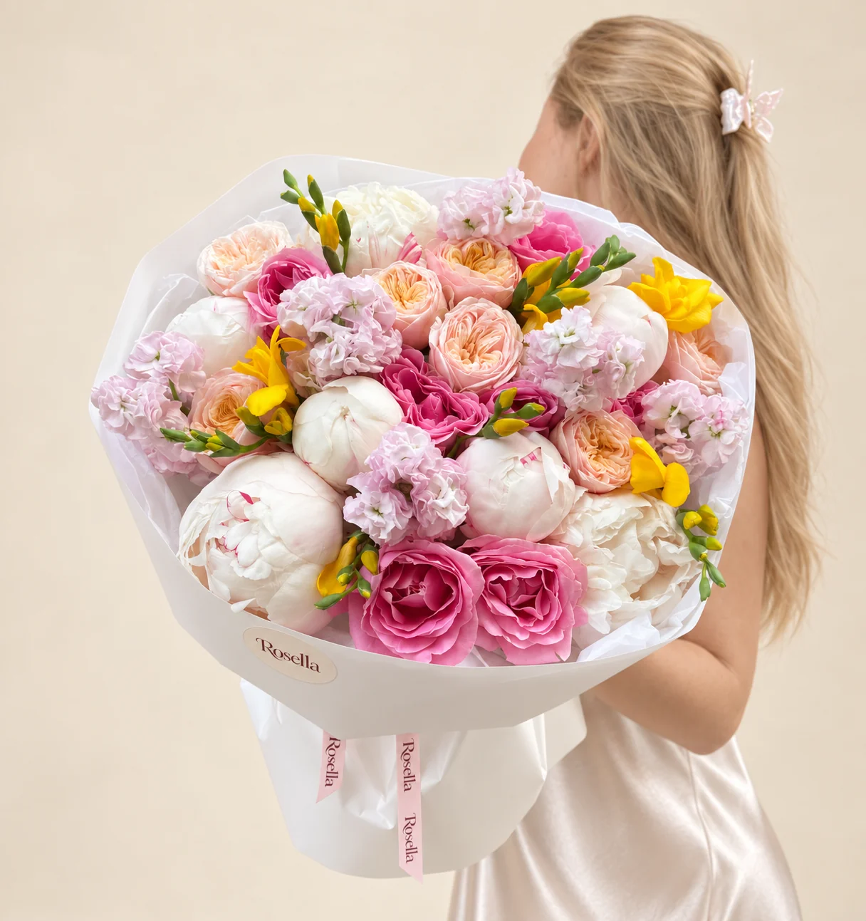 8 peonies, 8 garden roses, 8 roses, 4 stocks & 3 freesias in a hand-tied bouquet