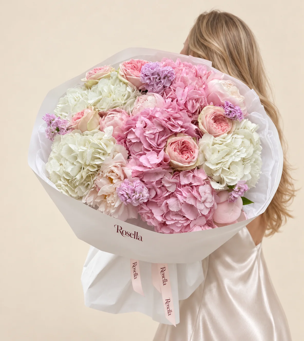 7 peonies, 3 white hydrangeas, 3 pink hydrangeas, 6 garden roses & 2 stocks in a hand-tied bouquet