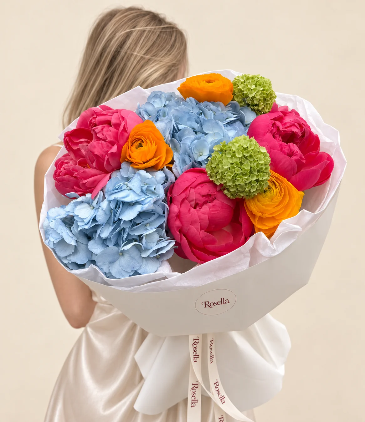 5 peonies, 2 hydrangeas, 2 green snowball viburnum & 3 ranunculus in a hand-tied bouquet