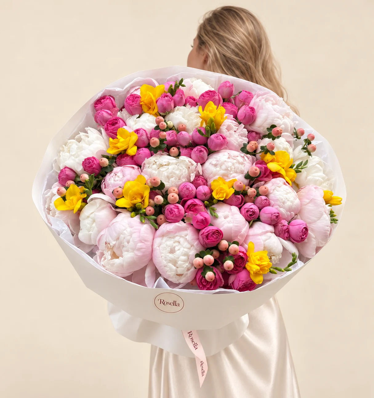 13 blush peonies, 56 spray roses, 11 white peonies & 5 freesias in a hand-tied bouquet
