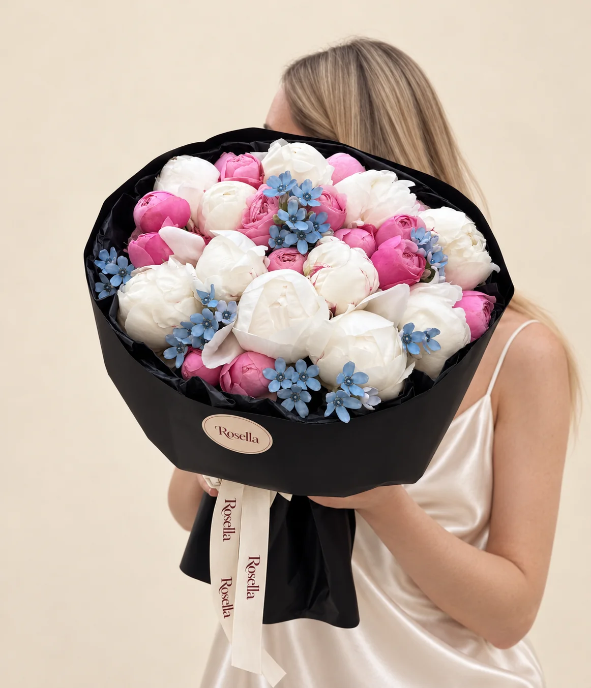 13 peonies, 16 spray roses & 30 tweedia blooms in a hand-tied bouquet