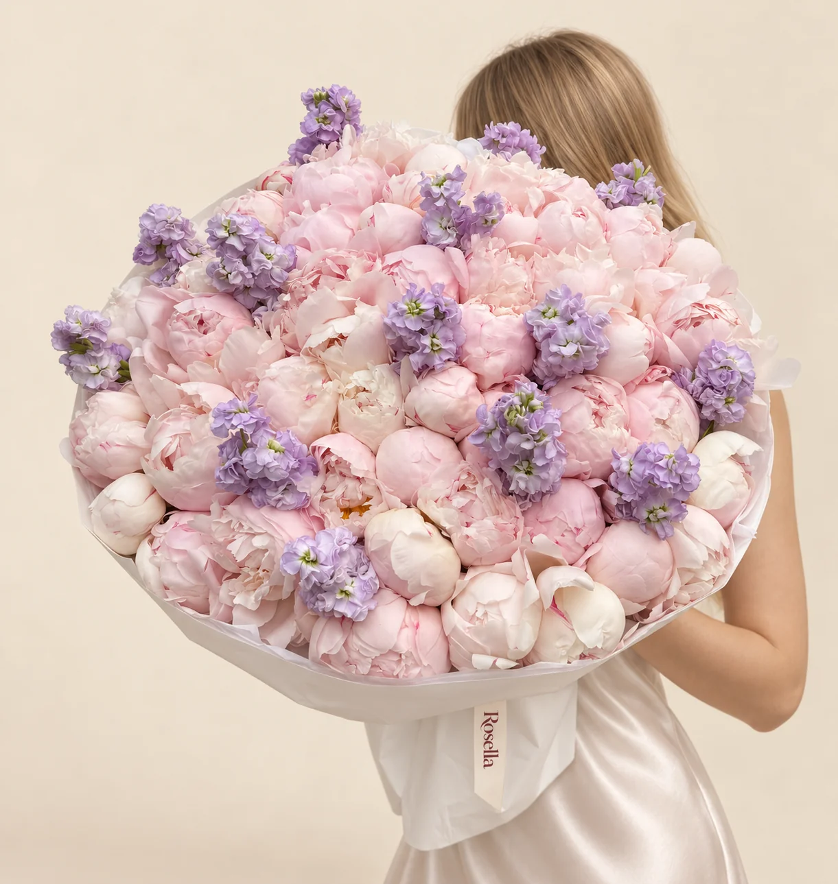 63 peonies & 9 stocks in a hand-tied bouquet