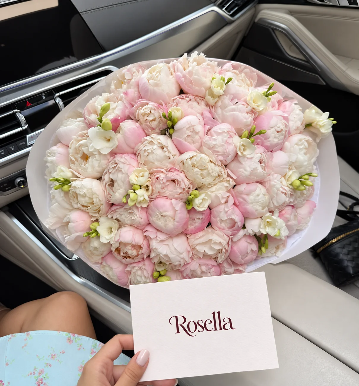 52 peonies & 6 freesias in a hand-tied bouquet