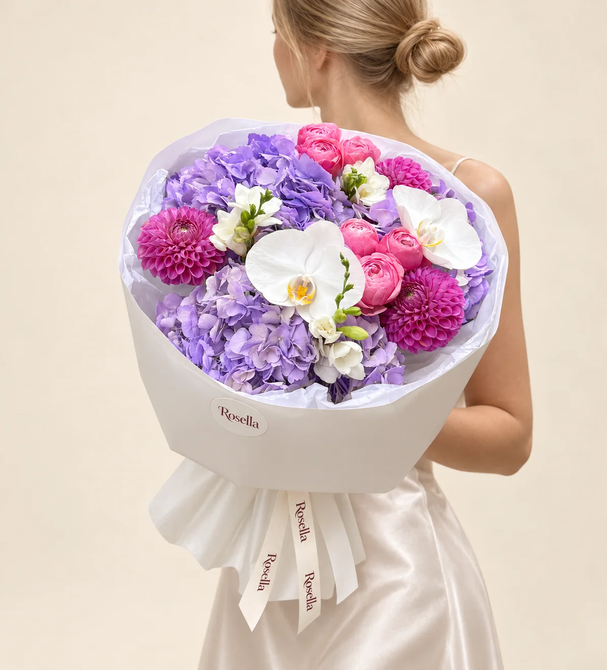 3 hydrangeas, 7 garden roses, 3 dahlias, 2 orchid blooms & 2 freesias in a hand-tied bouquet