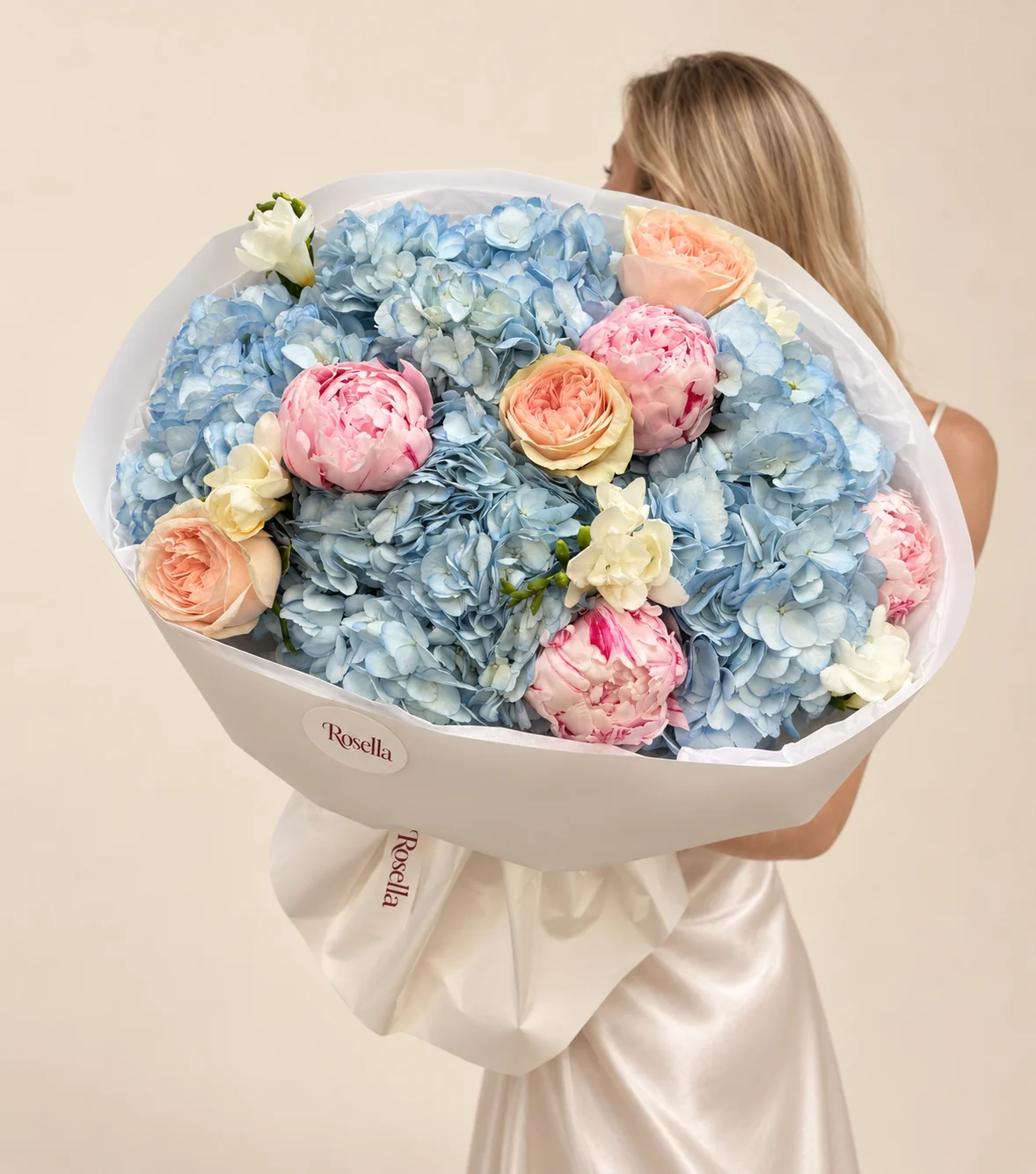 6 hydrangeas, 4 peonies, 3 garden roses & 3 freesias in a hand-tied bouquet