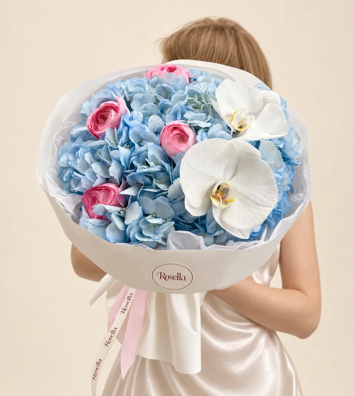 3 hydrangeas, 4 ranunculus & 2 orchid blooms in a hand-tied bouquet
