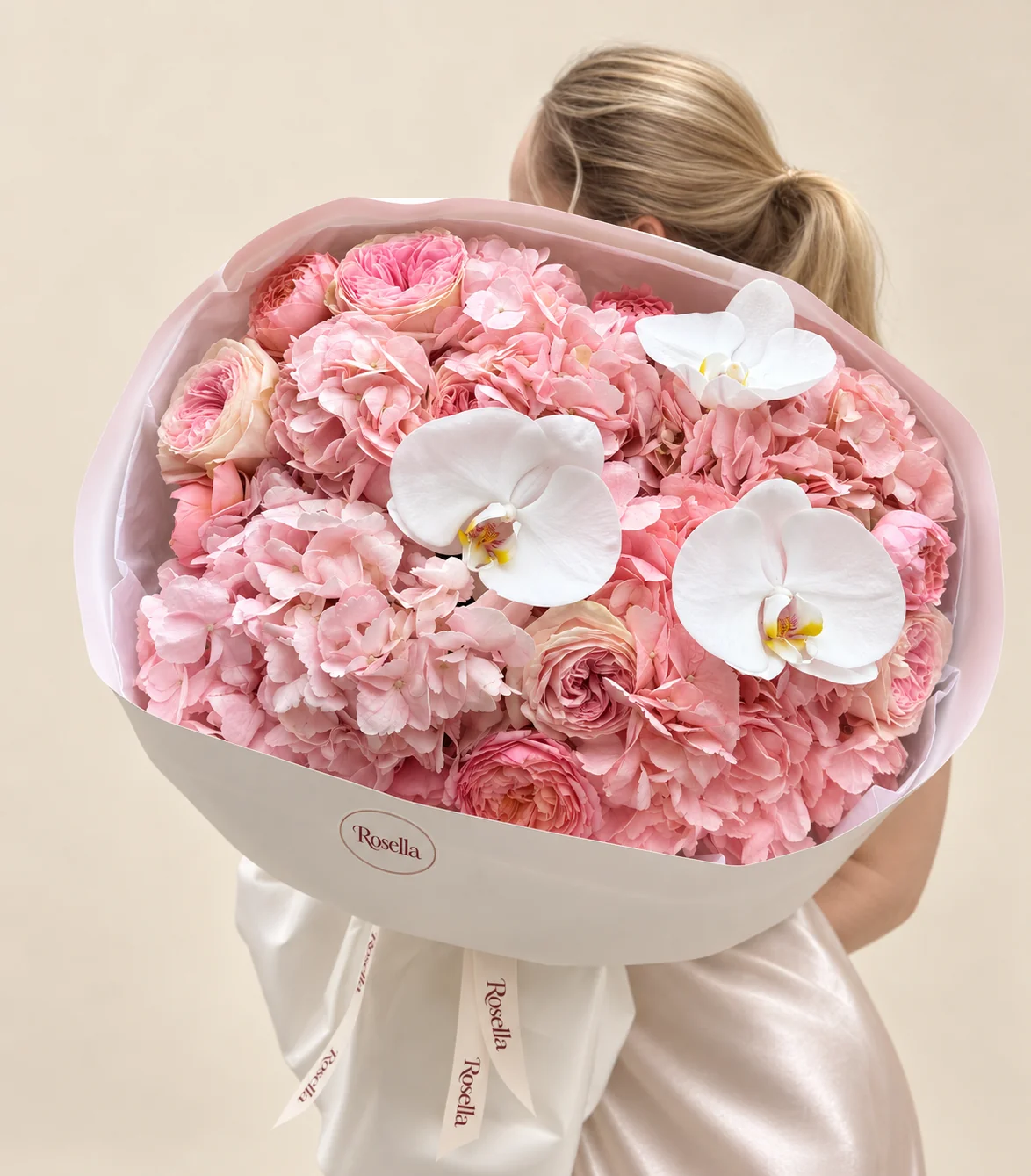 6 hydrangeas, 14 spray roses & 3 orchid blooms in a hand-tied bouquet