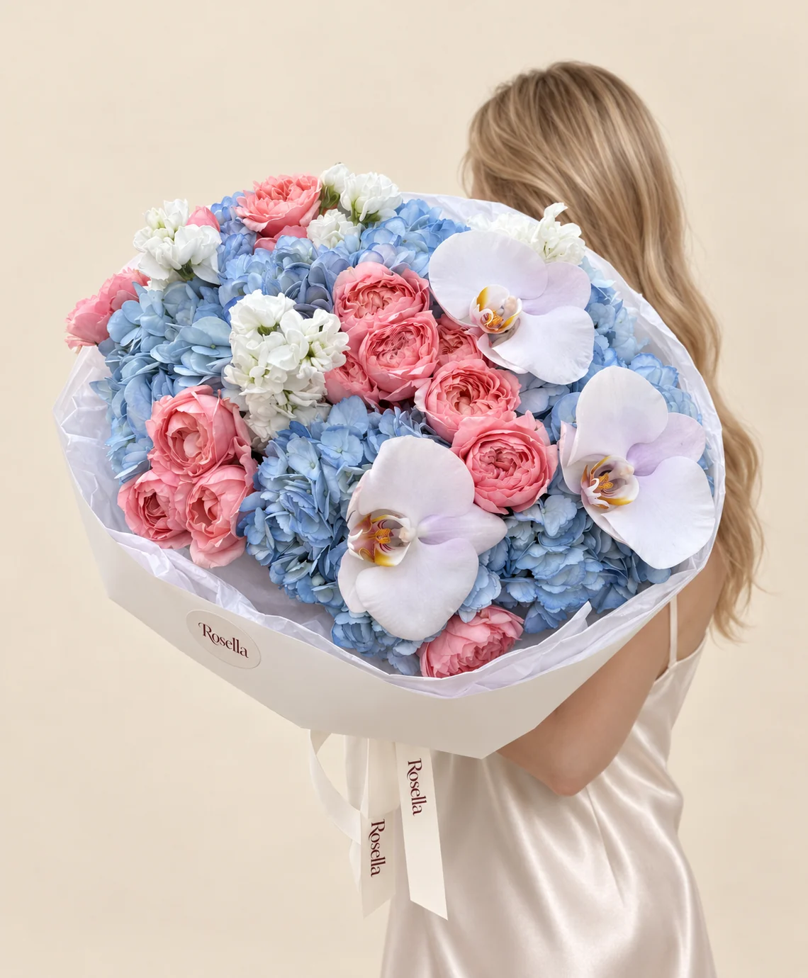 6 hydrangeas, 17 spray roses, 2 stocks & 3 orchid blooms in a hand-tied bouquet