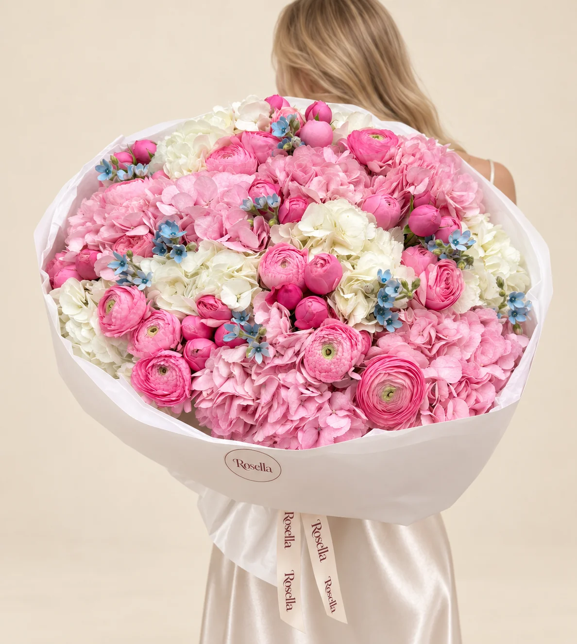 39 ranunculus, 7 pink hydrangeas, 7 white hydrangeas & 33 tweedia blooms in a hand-tied bouquet
