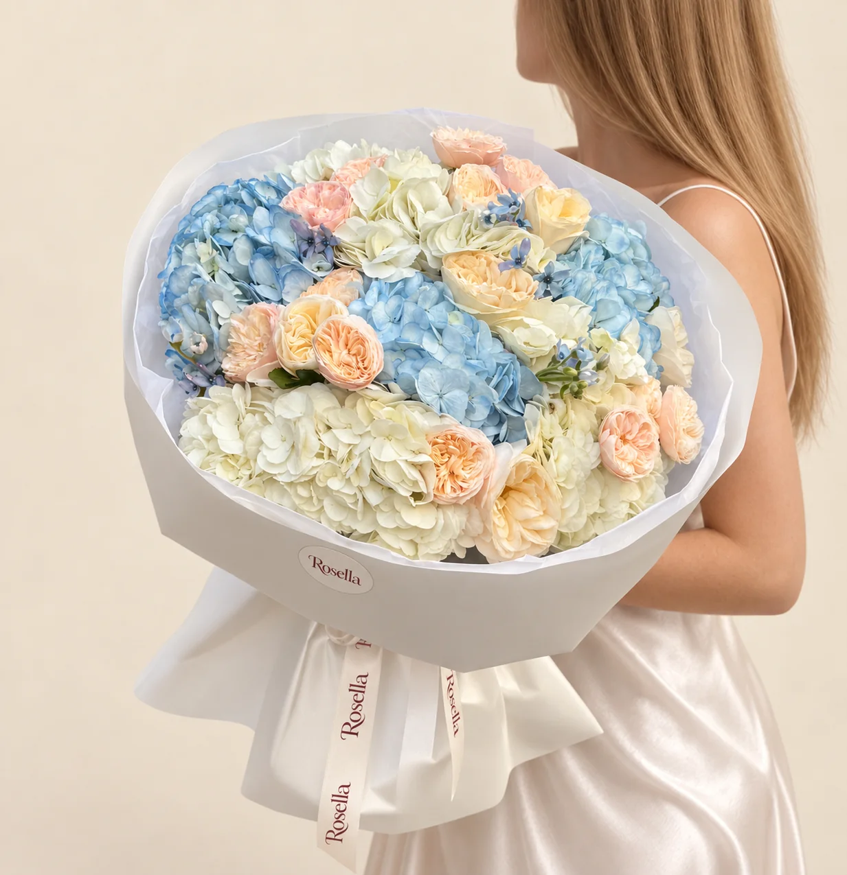 20 roses, 5 ivory hydrangeas, 3 blue hydrangeas & 18 tweedia blooms in a hand-tied bouquet