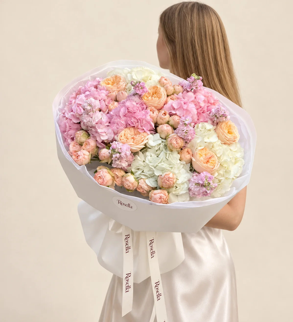 30 spray roses, 3 pink hydrangeas, 3 white hydrangeas, 6 garden roses & 5 stocks in a hand-tied bouquet