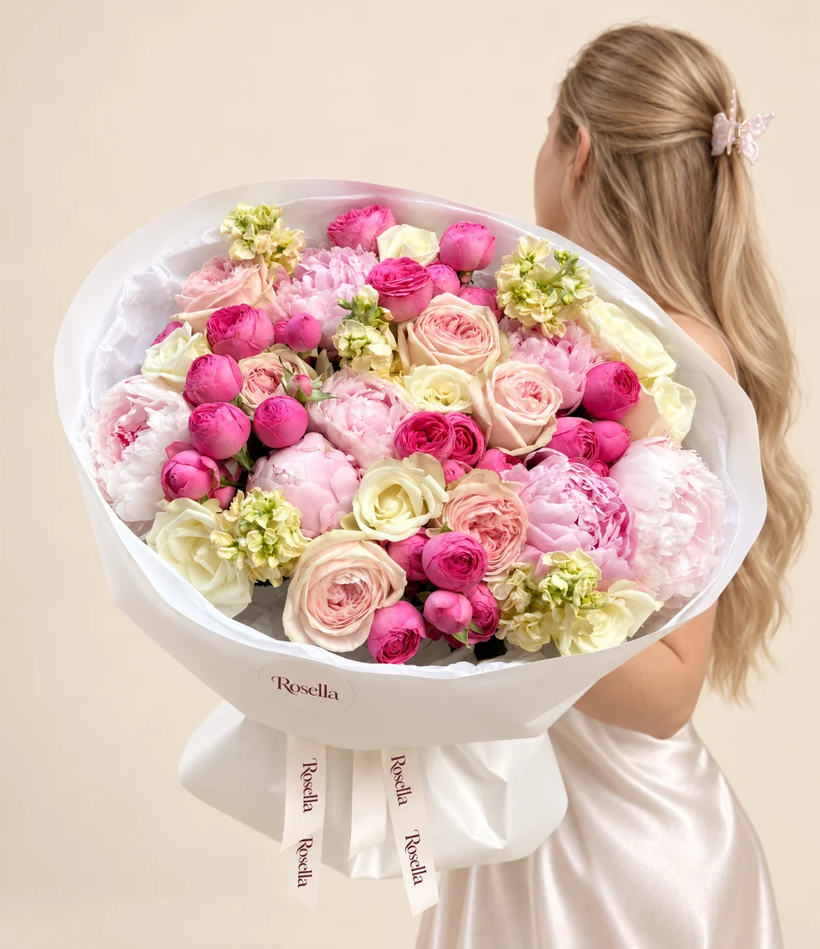 32 spray roses, 6 pink peonies, 7 garden roses, 9 roses, 5 stocks & 2 white peonies in a hand-tied bouquet