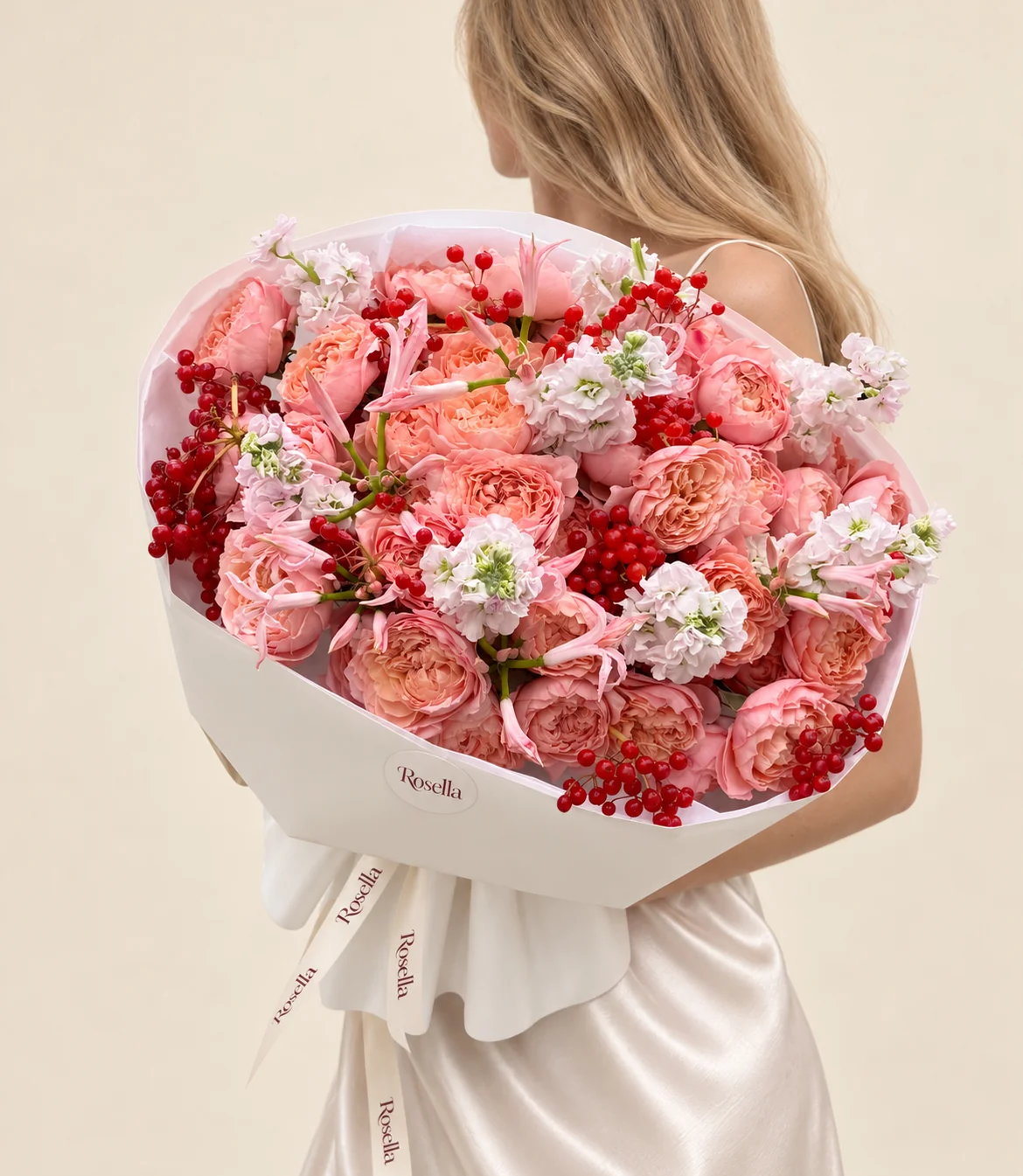 34 spray roses, 5 stocks & 13 pink nerine in a hand-tied bouquet