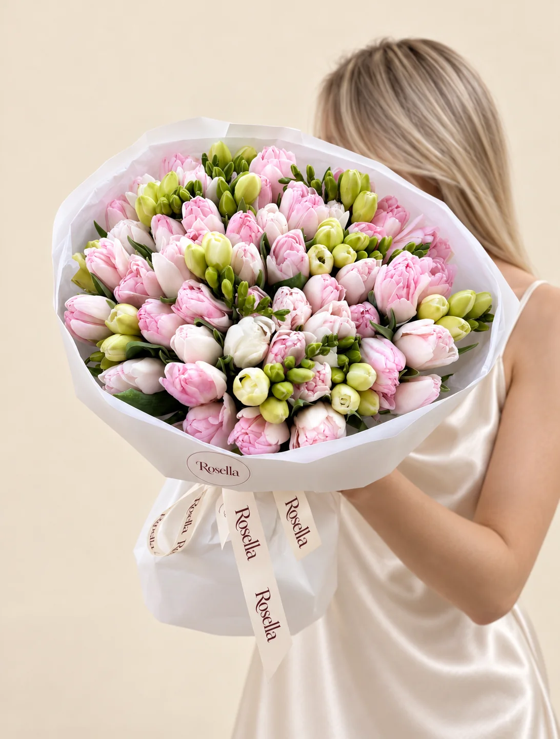 45 pink tulips, 9 freesias & 7 white tulips in a hand-tied bouquet
