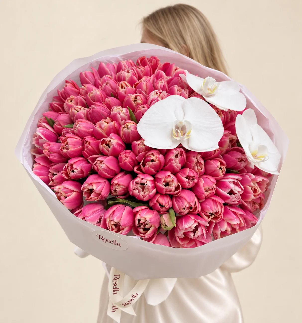 100 tulips & 3 orchid blooms in a hand-tied bouquet