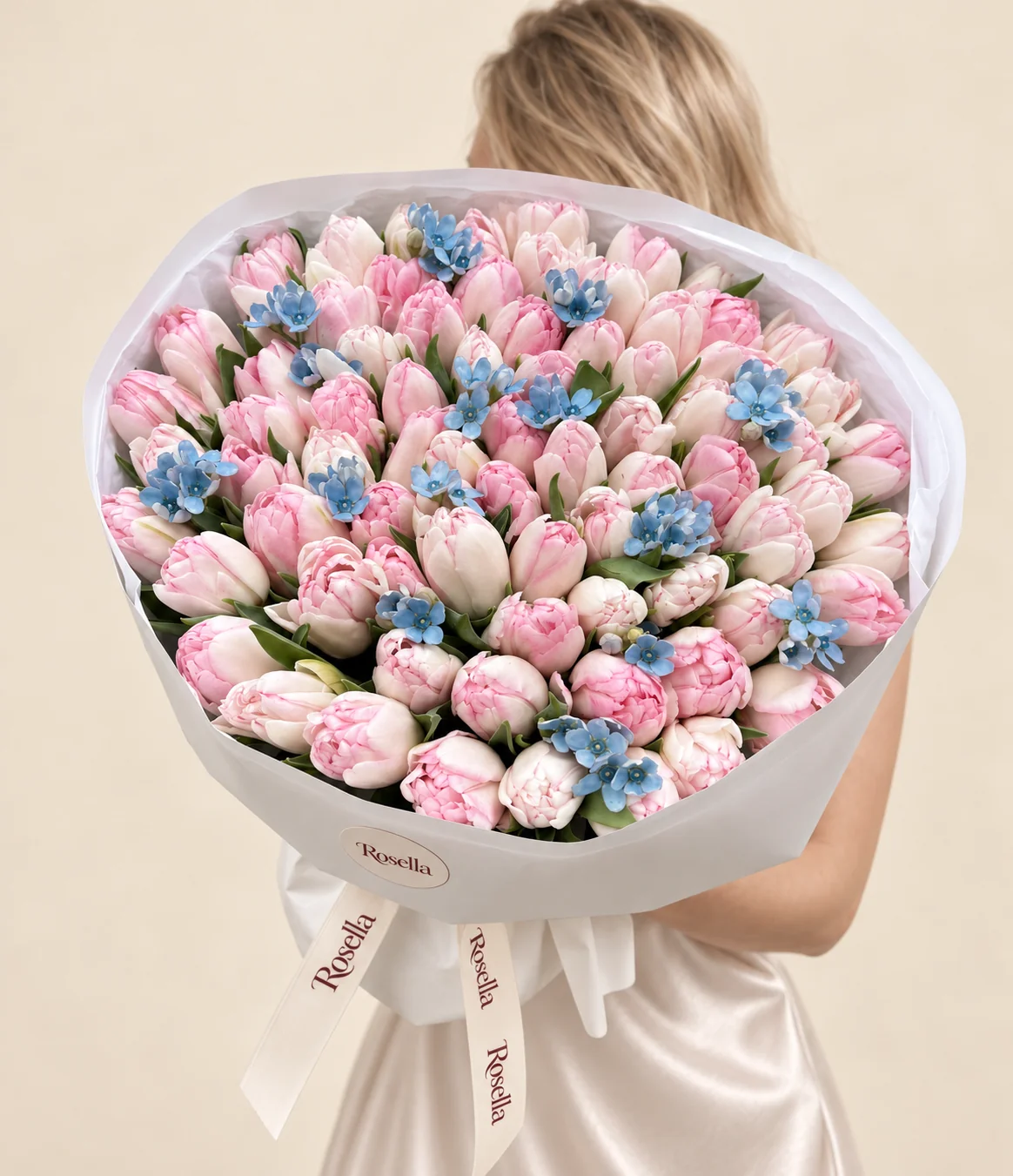 88 tulips & 55 tweedia blooms in a hand-tied bouquet